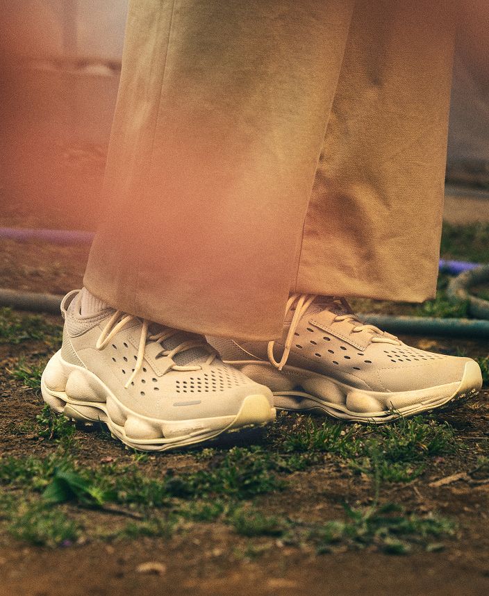 SpeedARC Trek shoes with tan trousers outdoors.